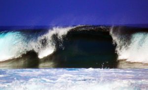 closeout wave breaking on the shore at Kahaluu in Kona on the Big Island of Hawaii