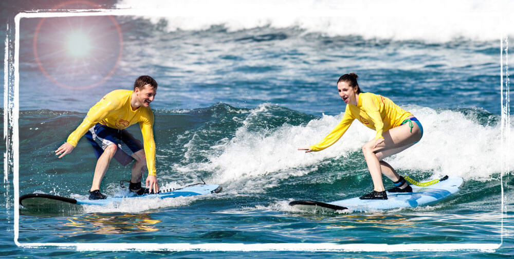 Couple taking a surf lesson in Kona, Hawaii